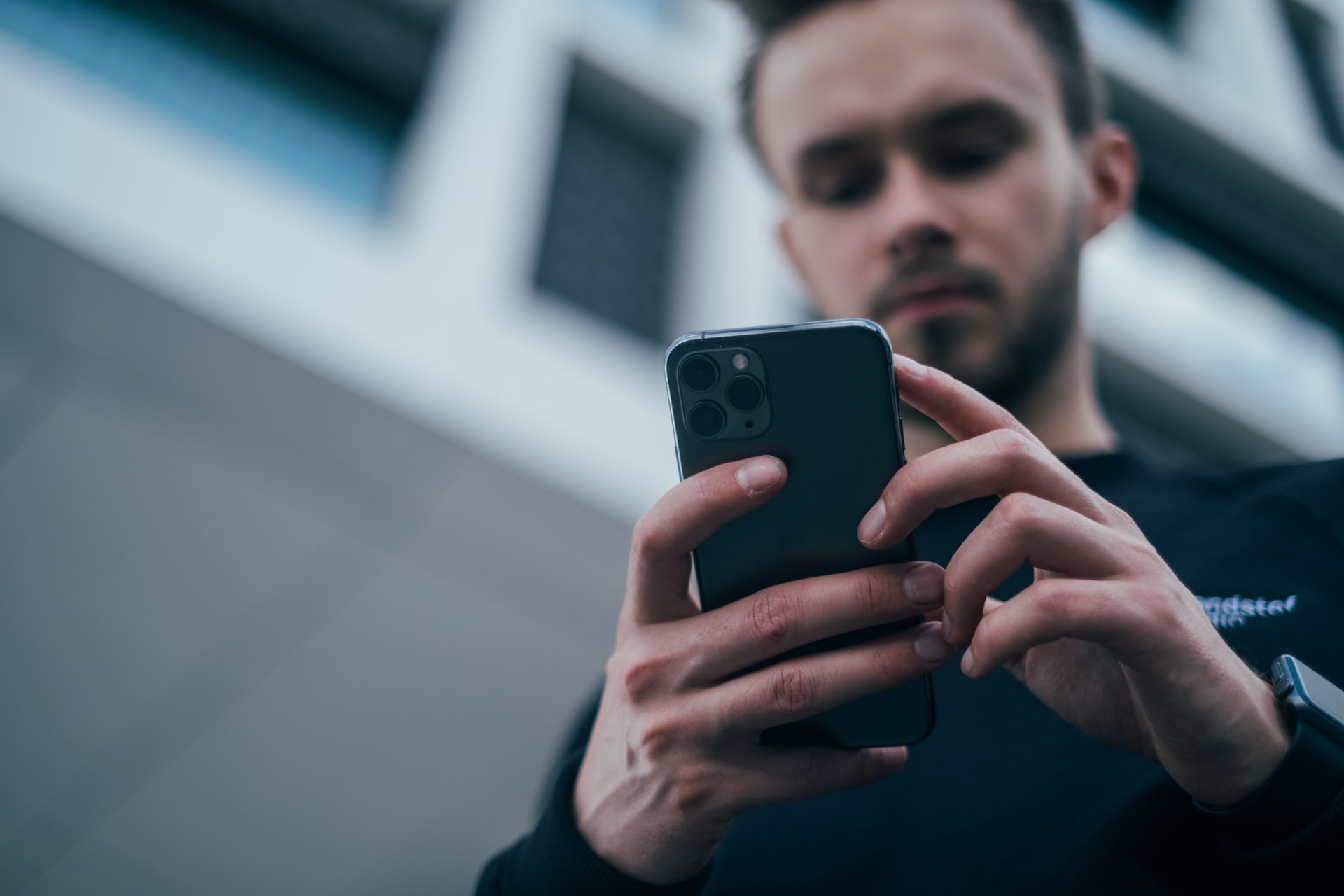 Photo of a man using a cell phone