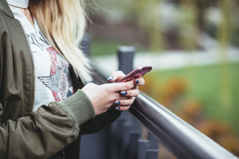 woman holding a cell phone